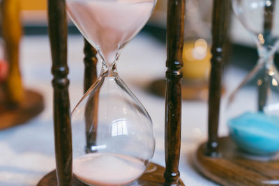 Close-up of hourglass on table