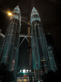 Low angle view of illuminated buildings at night