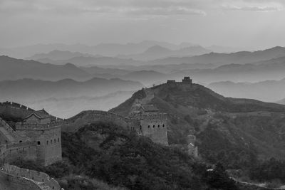 Castle on mountain against sky