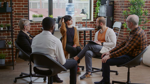 Group of people sitting on chair