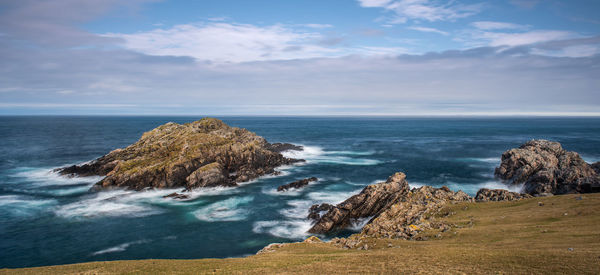 The small island of garbh-eilean near strathy point on the north coast of scotland