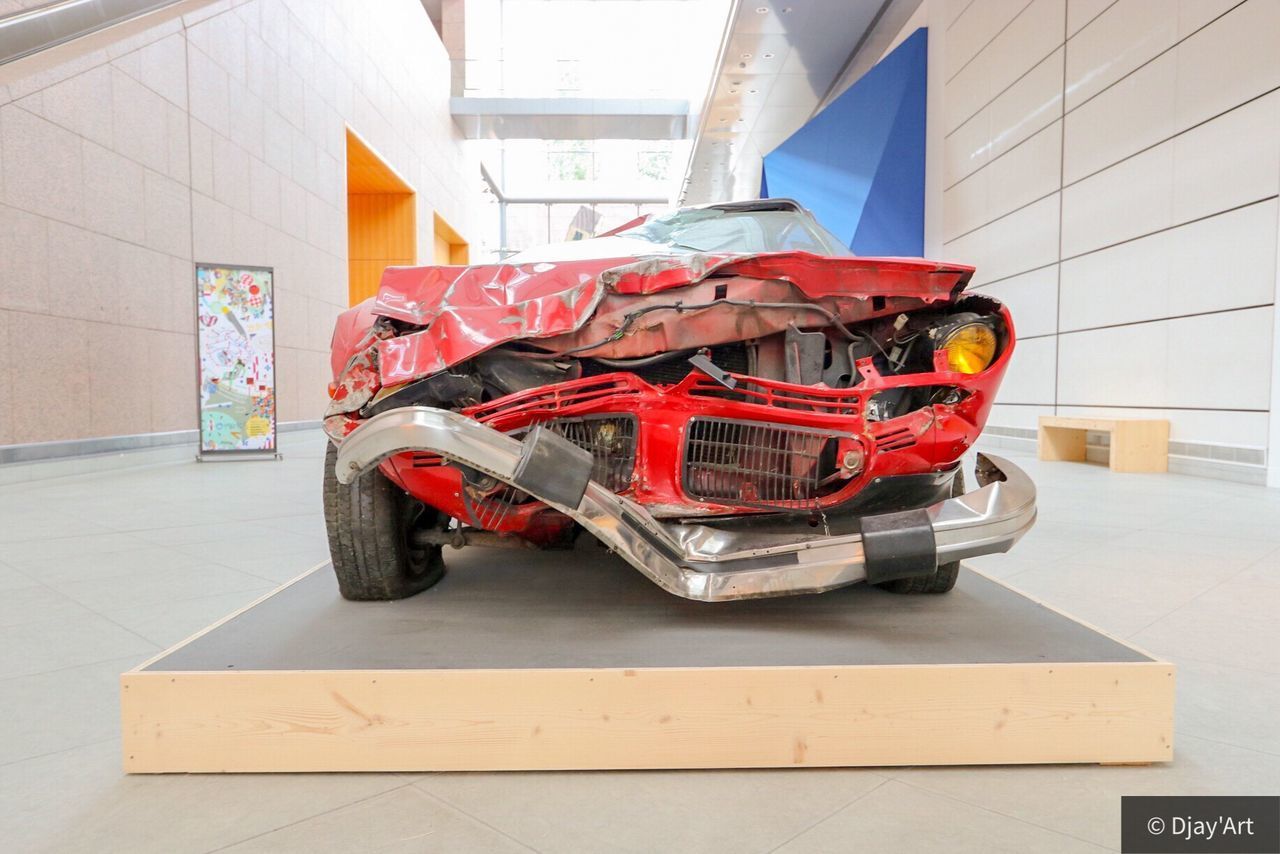 VIEW OF RED CART ON FLOOR IN GARAGE