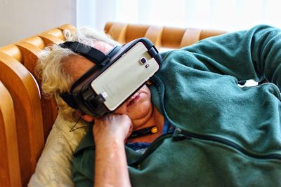 Midsection of man using mobile phone