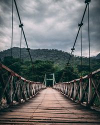 Footbridge against sky