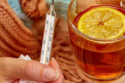 Close-up of hand holding drink