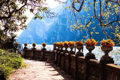 Scenic view of sea and mountains against sky