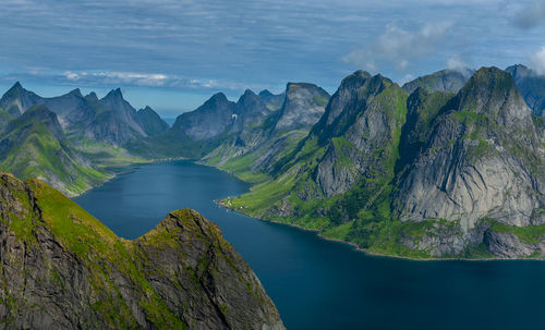 Scenic view of lake and mountains against sky