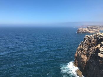 Scenic view of sea against blue sky