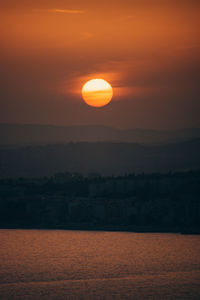 Scenic view of silhouette landscape against romantic sky at sunset