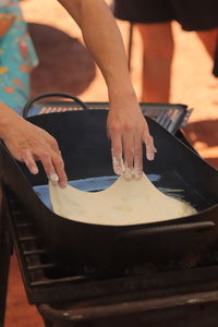 Midsection of man preparing food