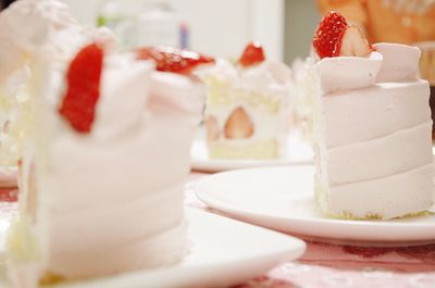 Close-up of cake slices served on table