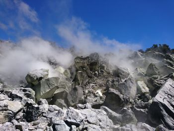 Scenic view of rocks against sky