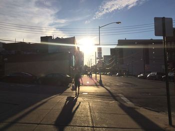 Sun shining through city street