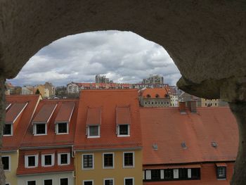 Low angle view of buildings in town against sky