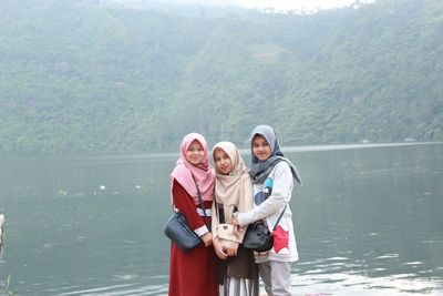 Portraits of smiling young hijab girls