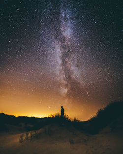 Scenic view of field against sky at night