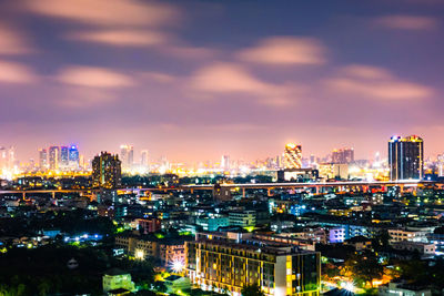 High angle view of illuminated city buildings at night