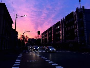 View of city street at sunset