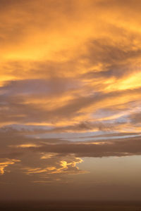 Low angle view of dramatic sky during sunset