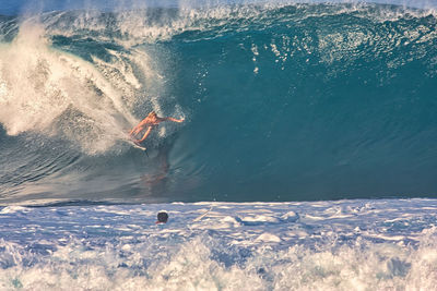 Person surfing in sea