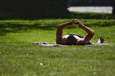 Man lying down on field