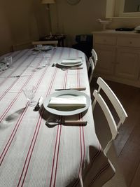 High angle view of empty chairs on table at home