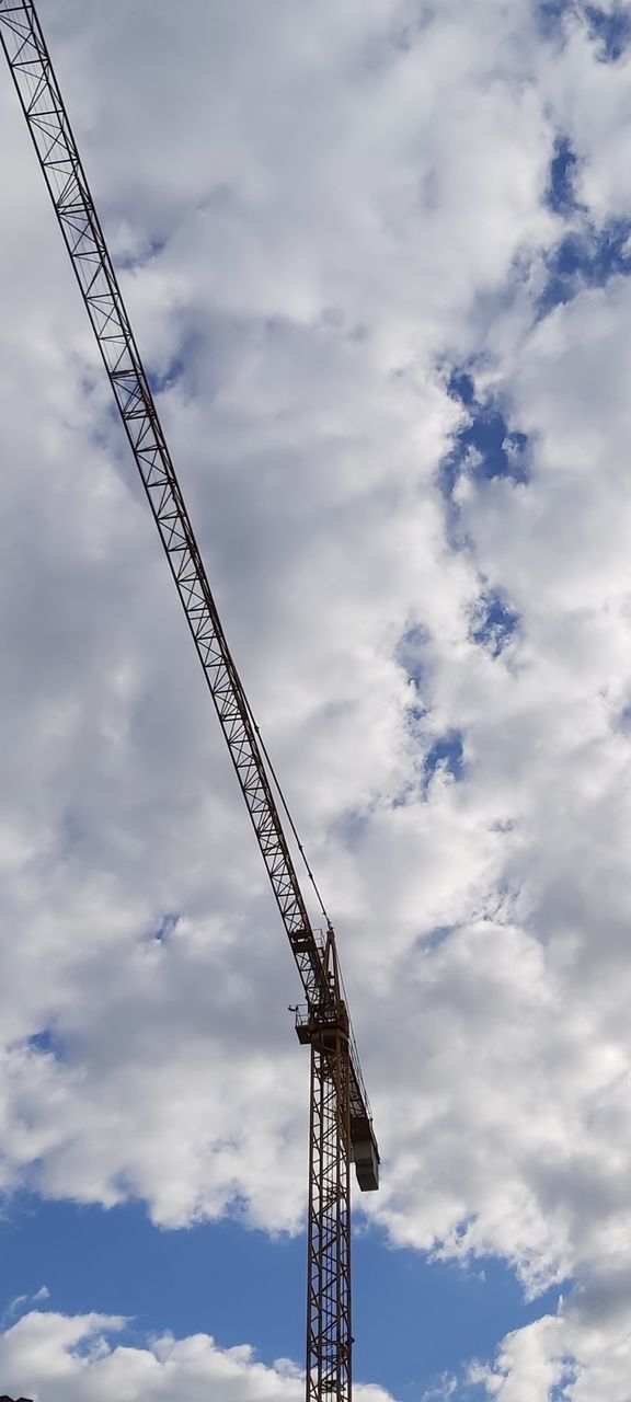 cloud - sky, sky, crane - construction machinery, machinery, low angle view, development, construction industry, construction site, industry, nature, no people, metal, construction machinery, tall - high, day, architecture, outdoors, built structure, construction equipment, overcast, alloy