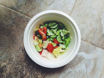 High angle view of vegetable salad in bowl on floor