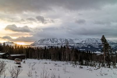Scenic view of dramatic sky during winter