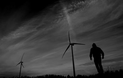 Low angle view of silhouette man against sky during sunset