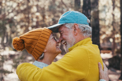 Side view of man wearing hat