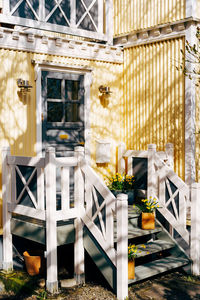 Potted plants on window of building