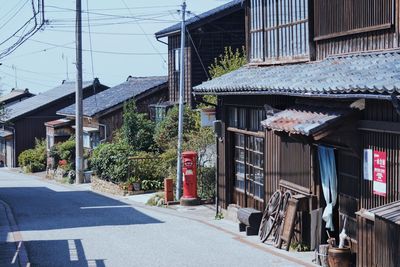 Street amidst houses and buildings in city