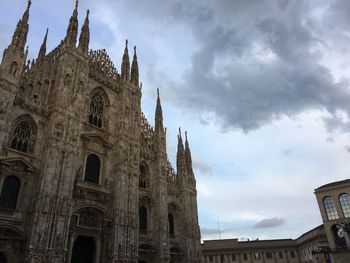 Low angle view of cathedral against cloudy sky