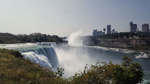 Scenic view of waterfall against clear sky