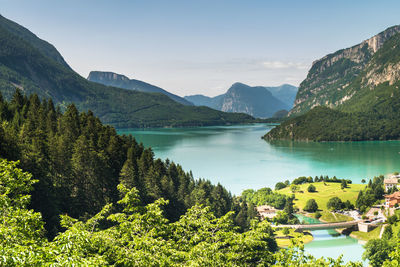 Scenic view of lake and mountains against sky