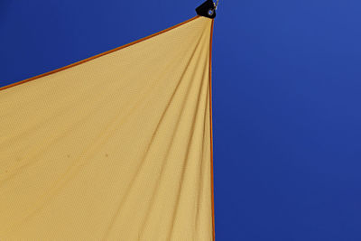 Low angle view of building against blue sky