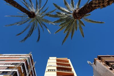 Low angle view of built structure against clear blue sky