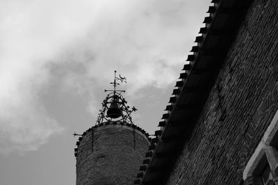 Low angle view of castle against cloudy sky