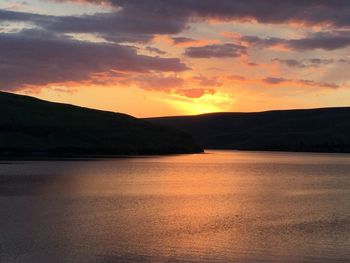 Scenic view of lake at sunset