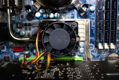 Close-up of computer processor fan and motherboard