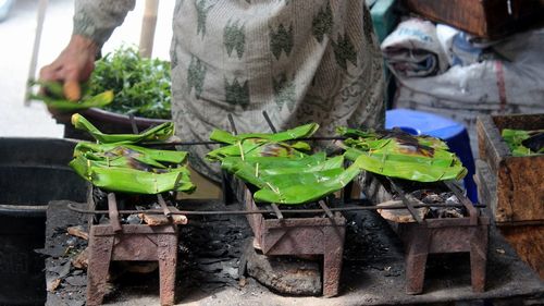 Midsection of man with vegetables