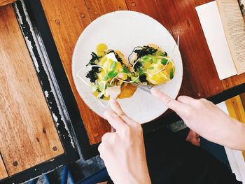 High angle view of woman holding food