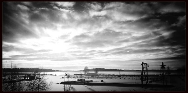 Scenic view of sea against cloudy sky