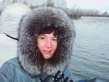 Portrait of smiling young woman in snow