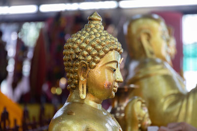 Close-up of statue against temple