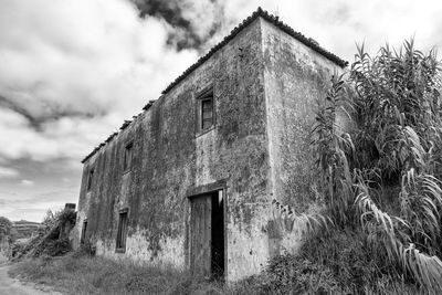 Low angle view of old building against sky