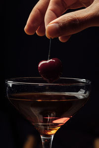 Cropped hand of man holding wineglass