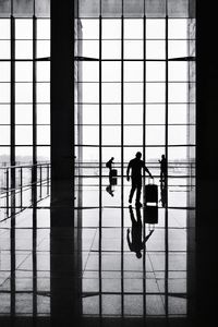 Silhouette man walking in building