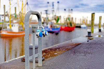 Close up of a vlave in a fish port against trawlers